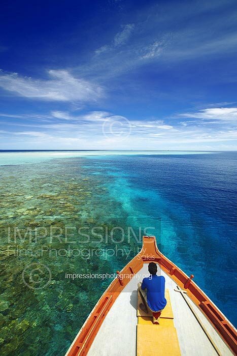 Maldives Traditional dhoni boat on coral reefs