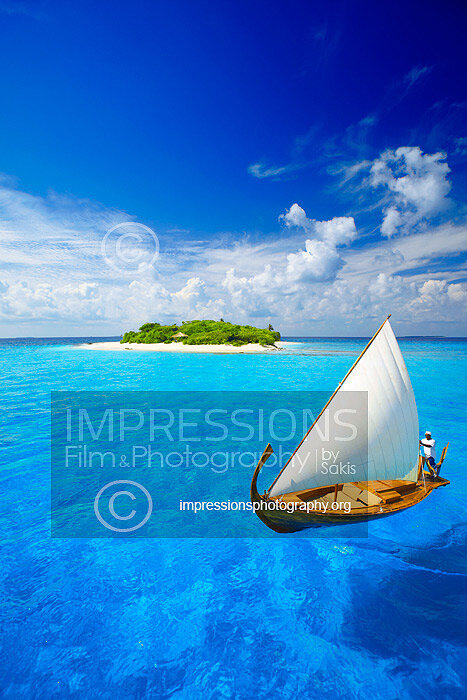 Maldives Traditional dhoni boat at tropical beach and tropical Maldives Island