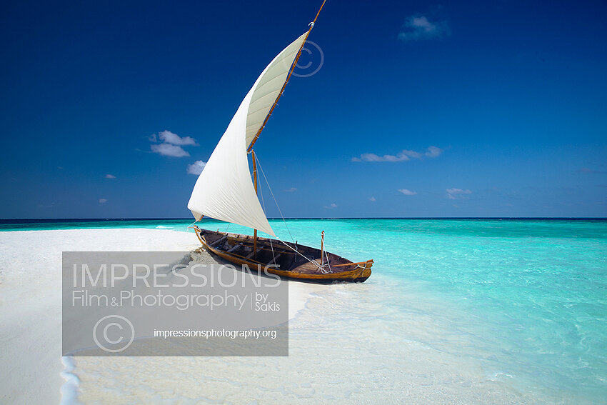 Maldives Traditional dhoni boat on maldives tropical beach