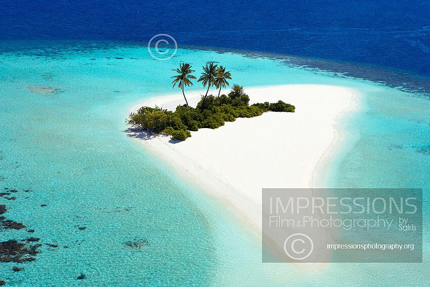 Aerial view of a beach and island in the Maldives