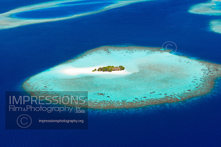 Aerial view of a small desert island, Maldives