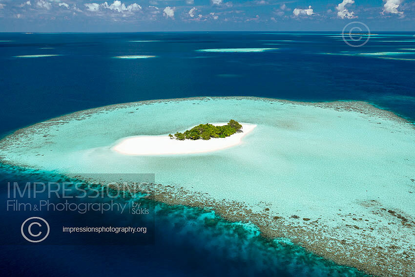 Aerial view of a beach and island in the Maldives