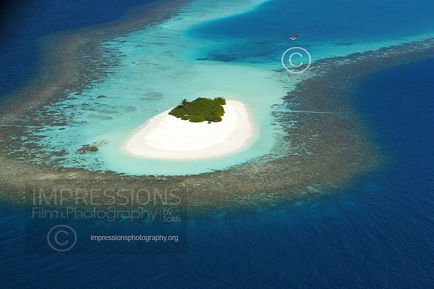 Aerial view of a beach Coral Reefs and island in the Maldives