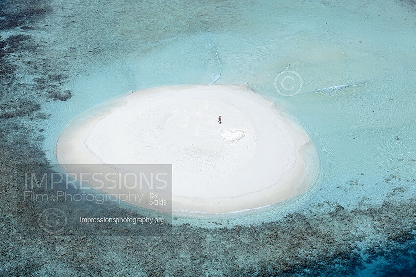 Aerial view of a beach Coral Reefs and island in the Maldives