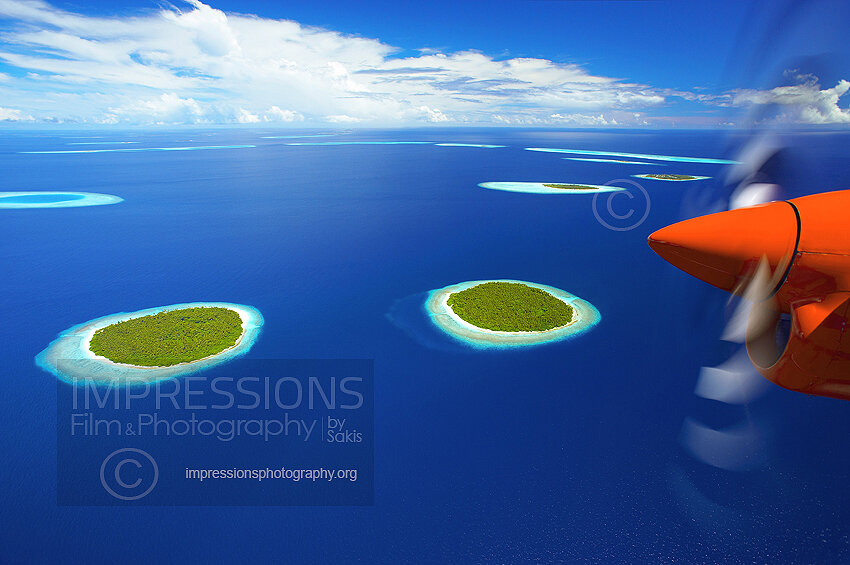 Maldives, Aerial view of Baa Atoll with seaplane