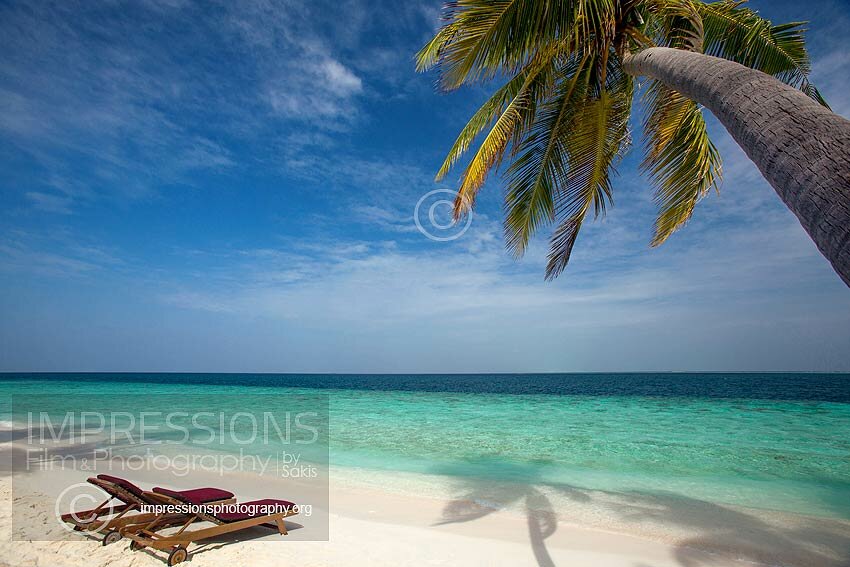 Sun loungers on a Maldives tropical Beach