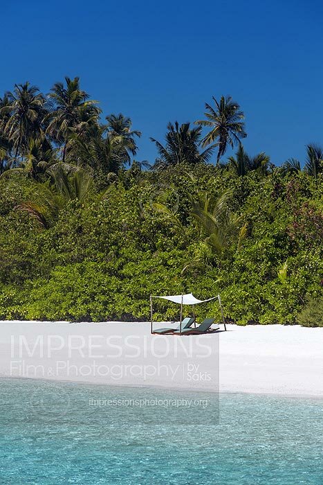 Sun loungers on a Maldives tropical Beach