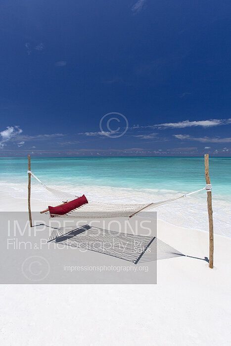 Hammock on a sandbank beach in Maldives