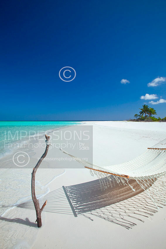 Maldives Hammock on a desert island tropical beach stock photo