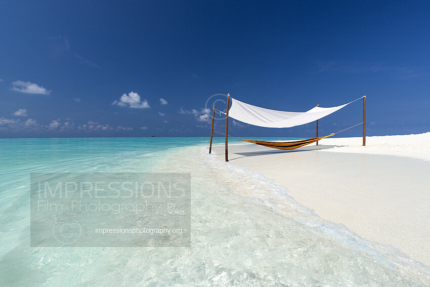 Hammock on a sandbank beach in Maldives