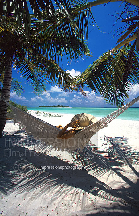Woman in hammock on a Maldives tropical beach