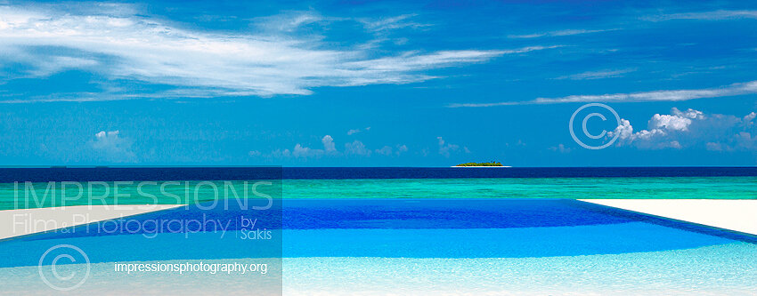 Infinity swimming pool with view at tropical island and shades of blue in Maldives Stock Photo