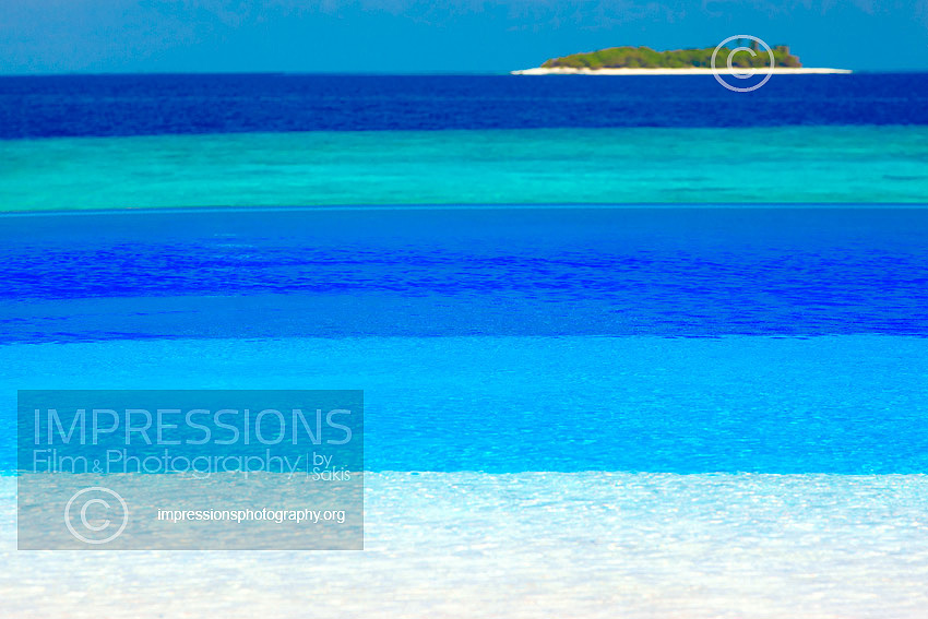 maldives stock photo infinity swimming pool with view at tropical island and shades of blue