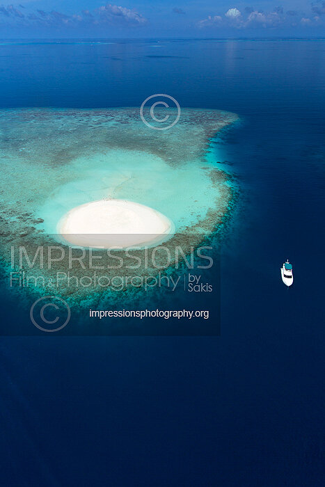 Aerial view of a beach Coral Reefs and island in the Maldives