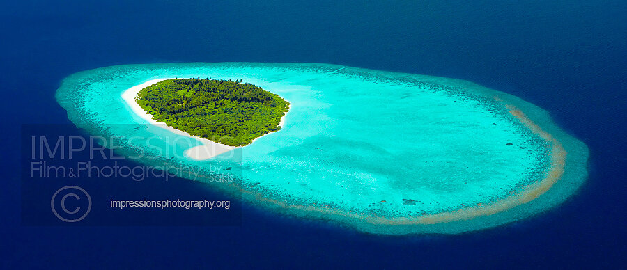 Aerial view of a beach Coral Reefs and island in the Maldives