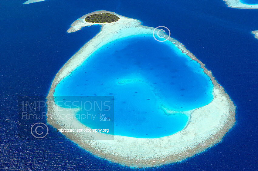 Maldives, Aerial view of coral reefs and island