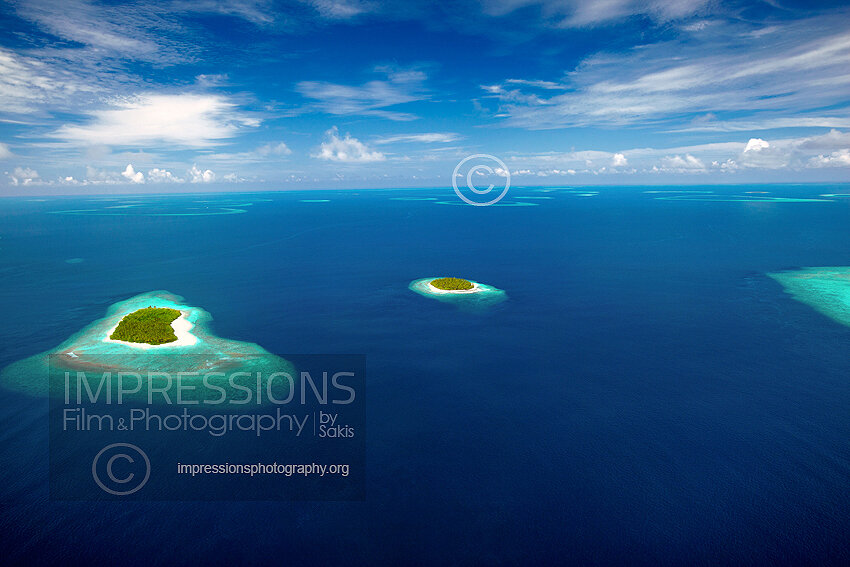 Maldives, Aerial view of coral reefs and islands