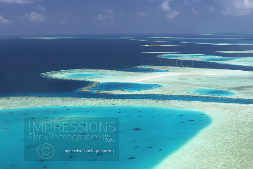 Maldives, Aerial view of coral reefs and sandbank