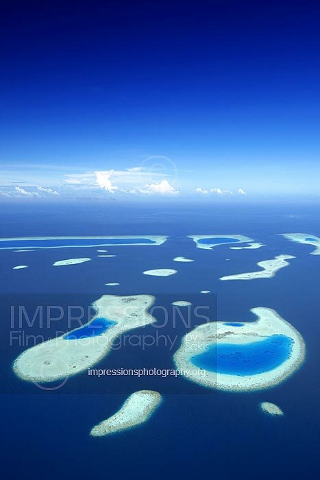 Maldives, Aerial view of coral reefs and sandbank