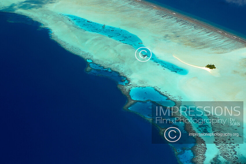 Maldives, Aerial view of coral reefs and island