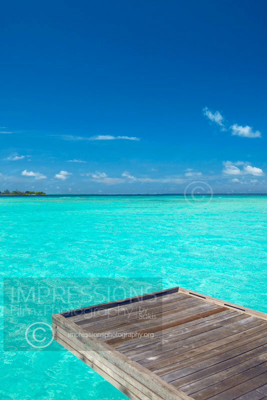 Maldives Stock photo of a wooden jetty out to tropical sea