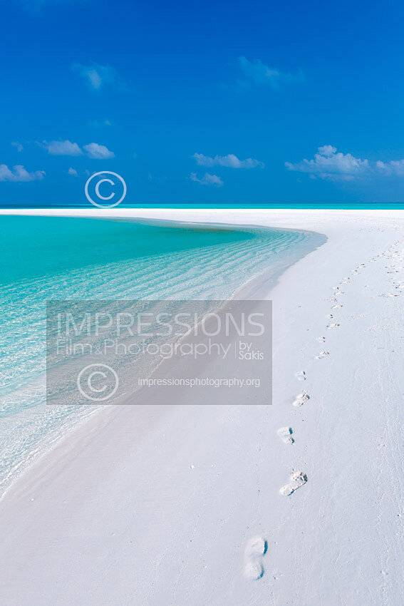 maldives stock photo Footprints on tropical beach