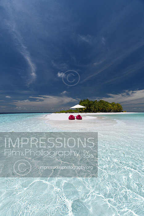 maldives stock photo lounge chairs and sun umbrella on tropical beach stock photo