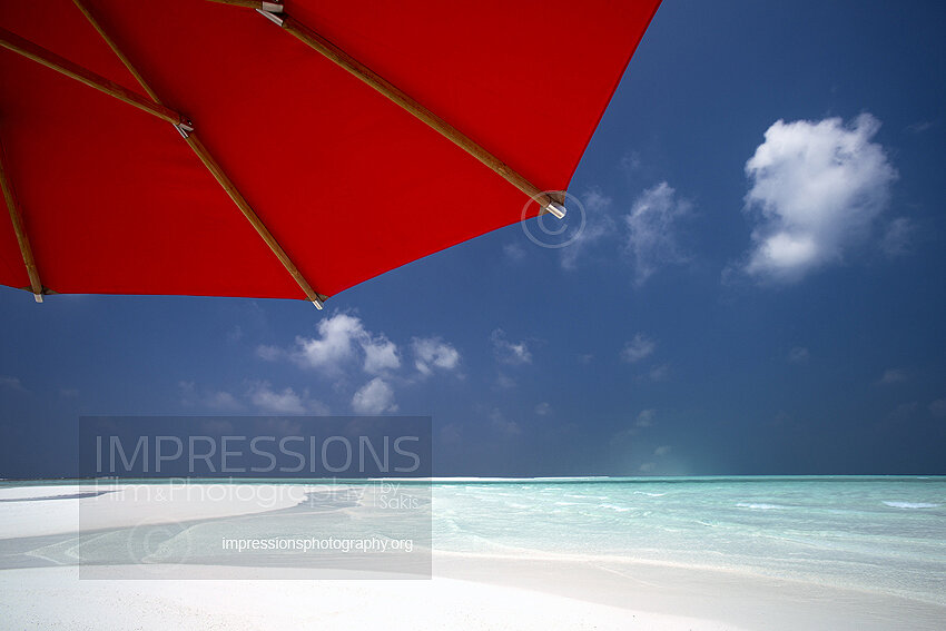 maldives stock red sun umbrella on tropical beach