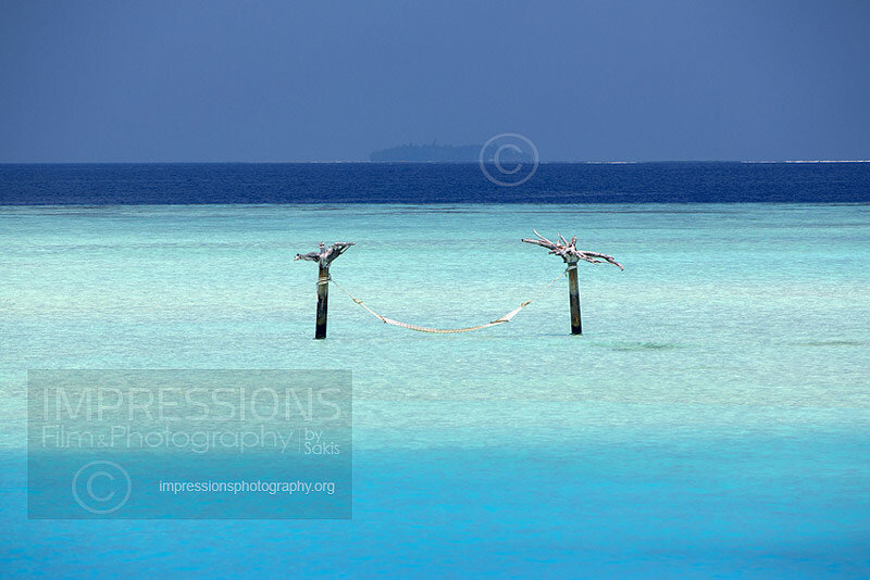 Maldives, water hammock in turquoise blue lagoon Stock Photo