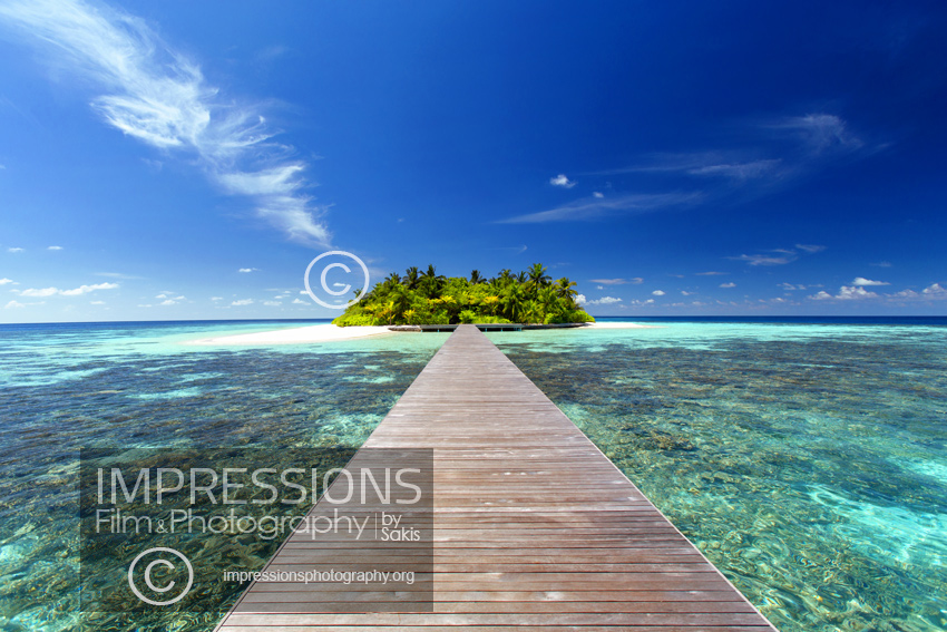 maldives stock photo wooden jetty leading to tropical island over lagoon and coral reefs