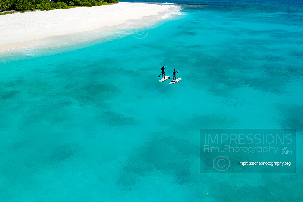 Aerial photography seychelles private island cousine guest lifestyle paddle board