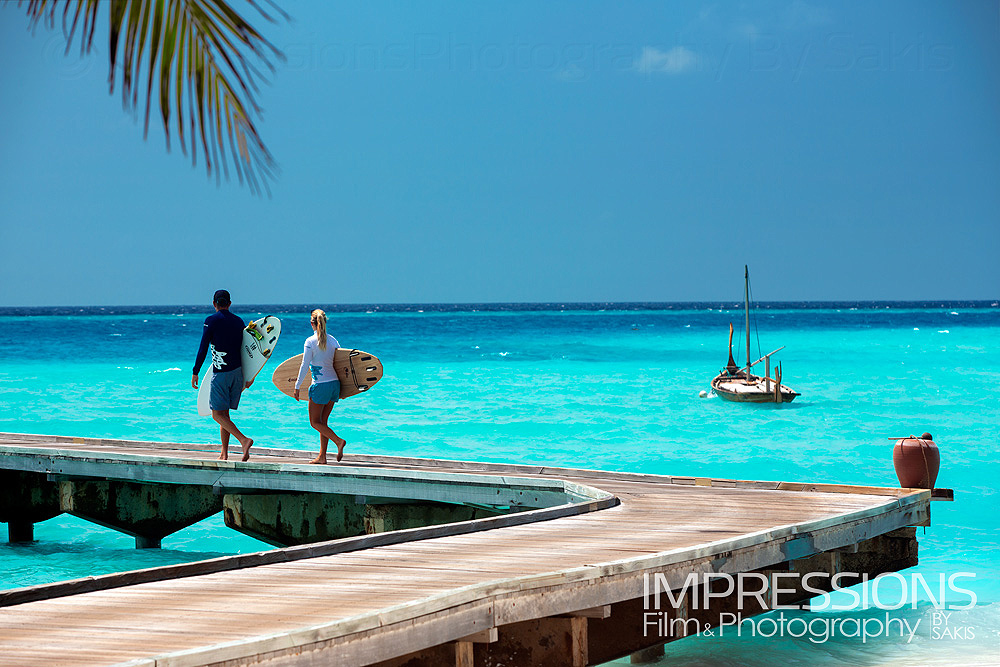 Lifestyle Photography - Couple of surfers on Gili Lankanfushi Maldives jetty