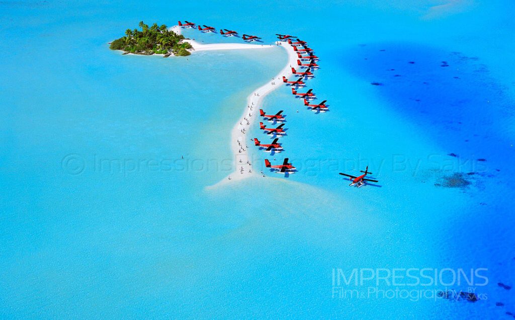 aerial photo of an entire Maldives seaplane fleet on a desert island