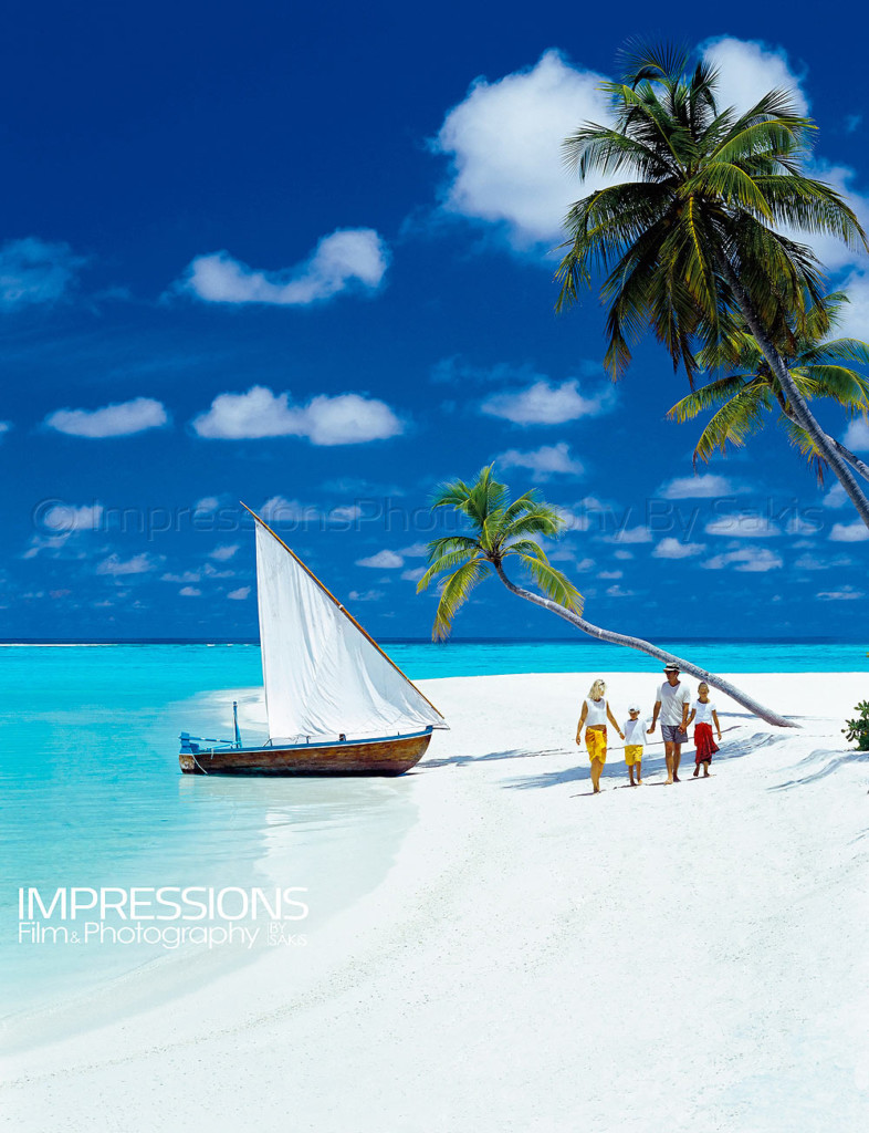 family walking beach maldives small dhoni boat