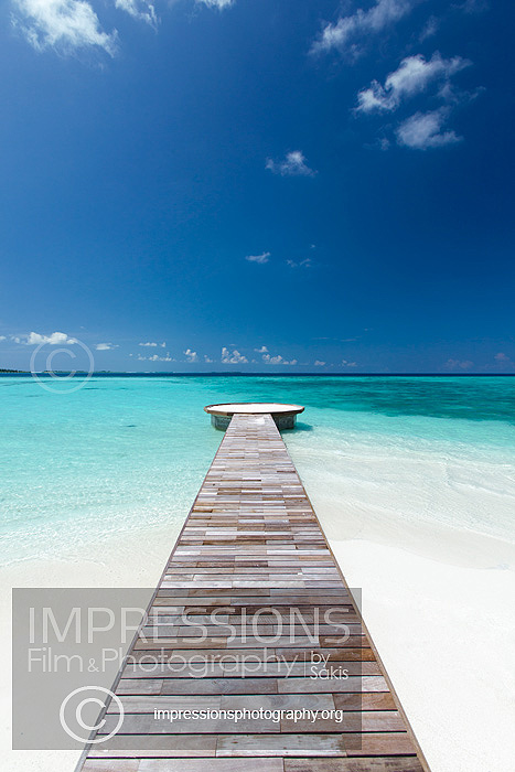 jetty leading to ocean, maldives stock photo