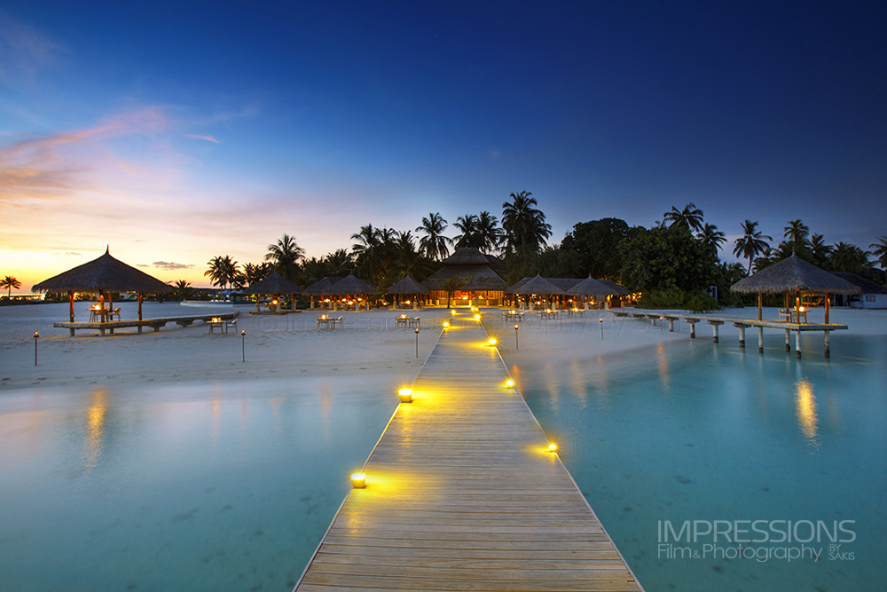 velassaru jetty maldives resort at sunset