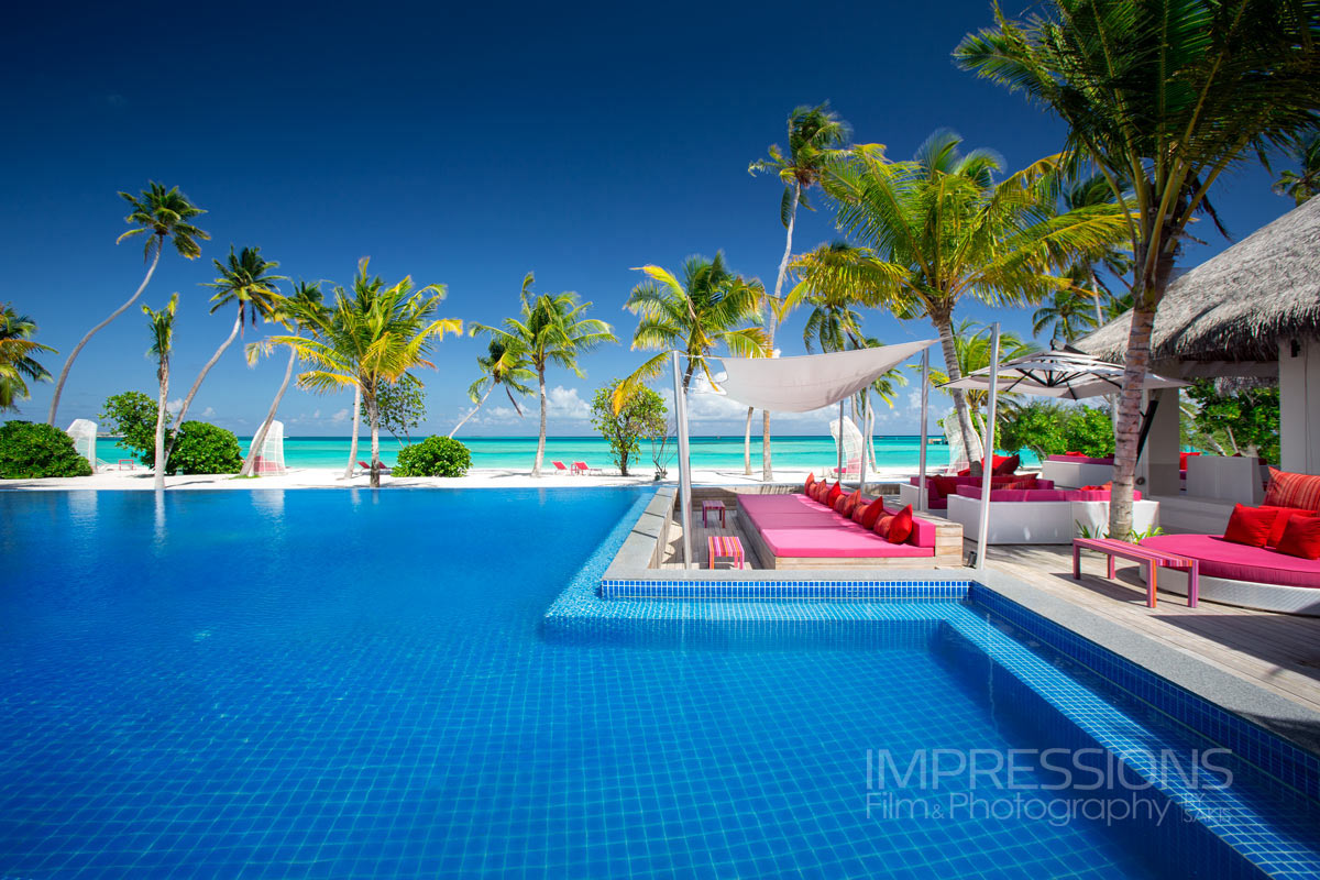 kandima maldives pool sunbeds tropical lifestyle