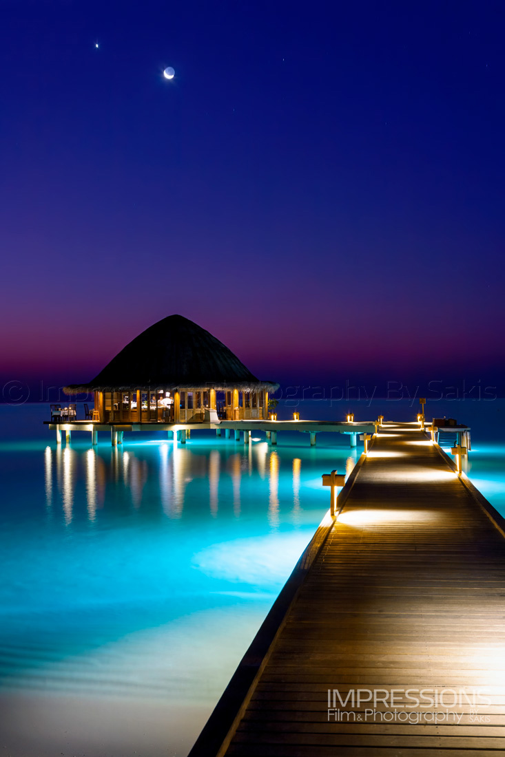 Moon and venus star in sunset sky maldives