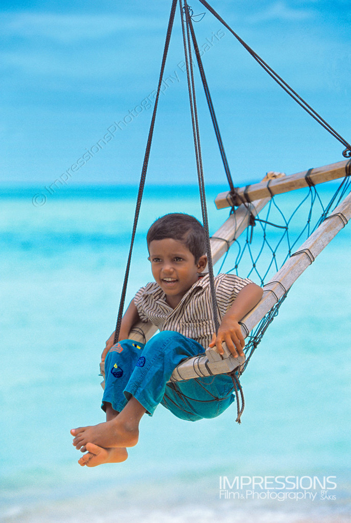 portrait of a maldivian child in a joali on a Maldives local island