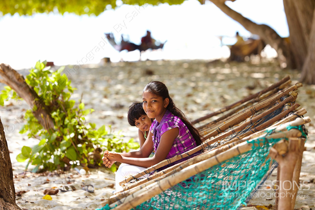 photo of maldivian children sitting on joalis on a Maldives local island