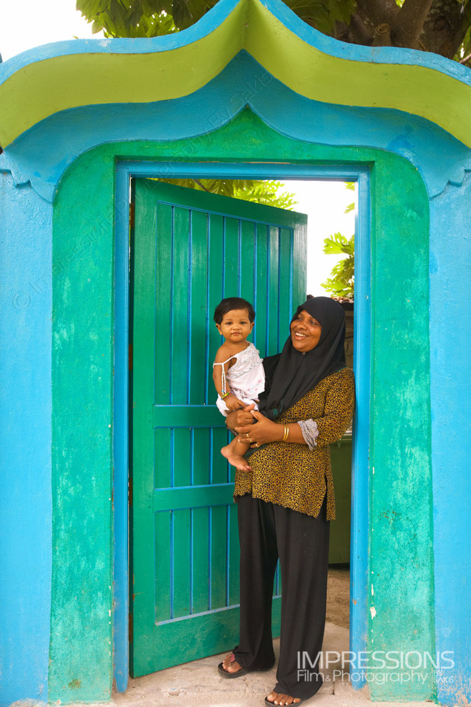 photo of a happy mother and her young baby girl on a Maldives local island - photos of the people of Maldives series