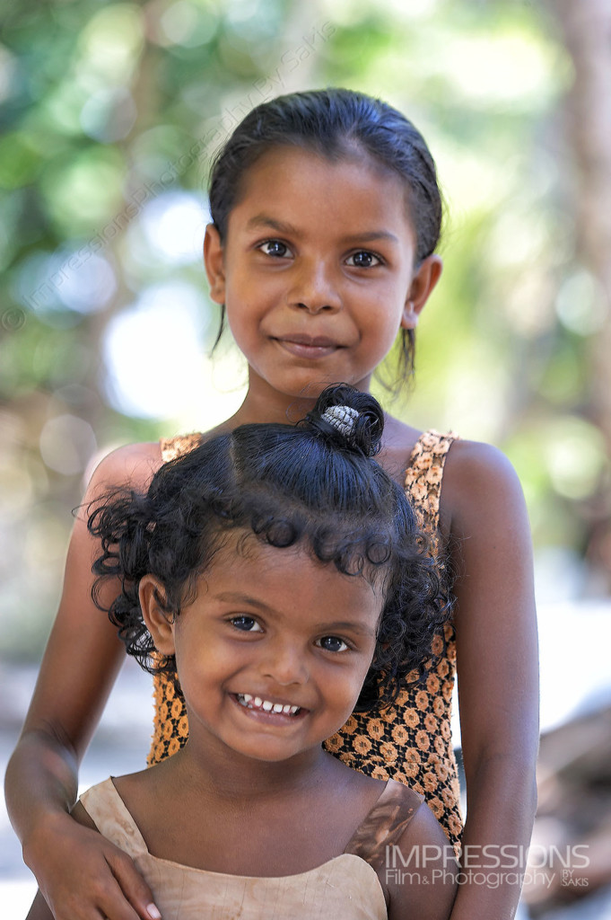 portrait of young sister girls on a Maldives local island