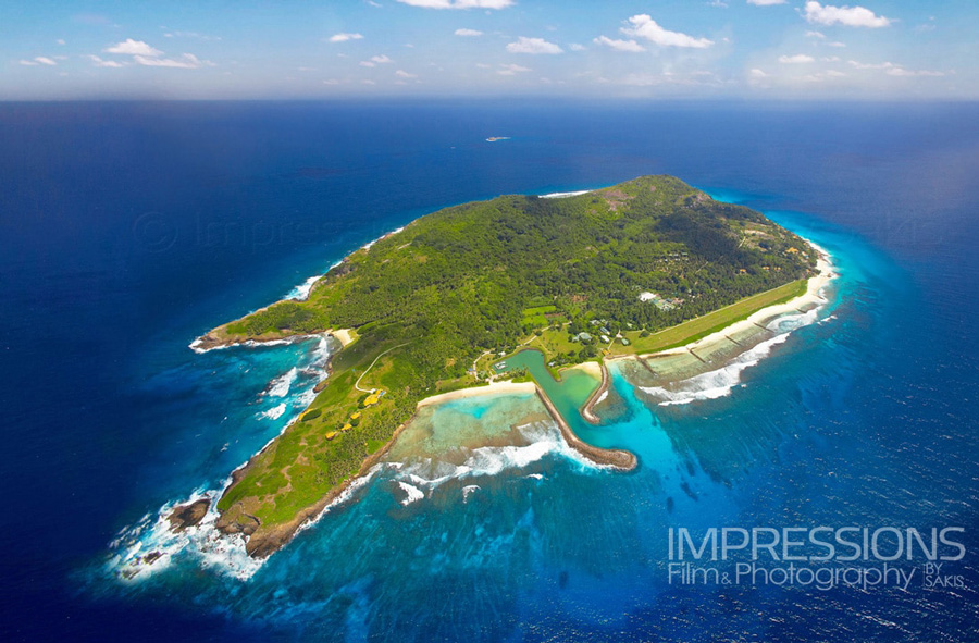 hotel aerial photography from an helicopter - view of the entire island shot at a high altitude