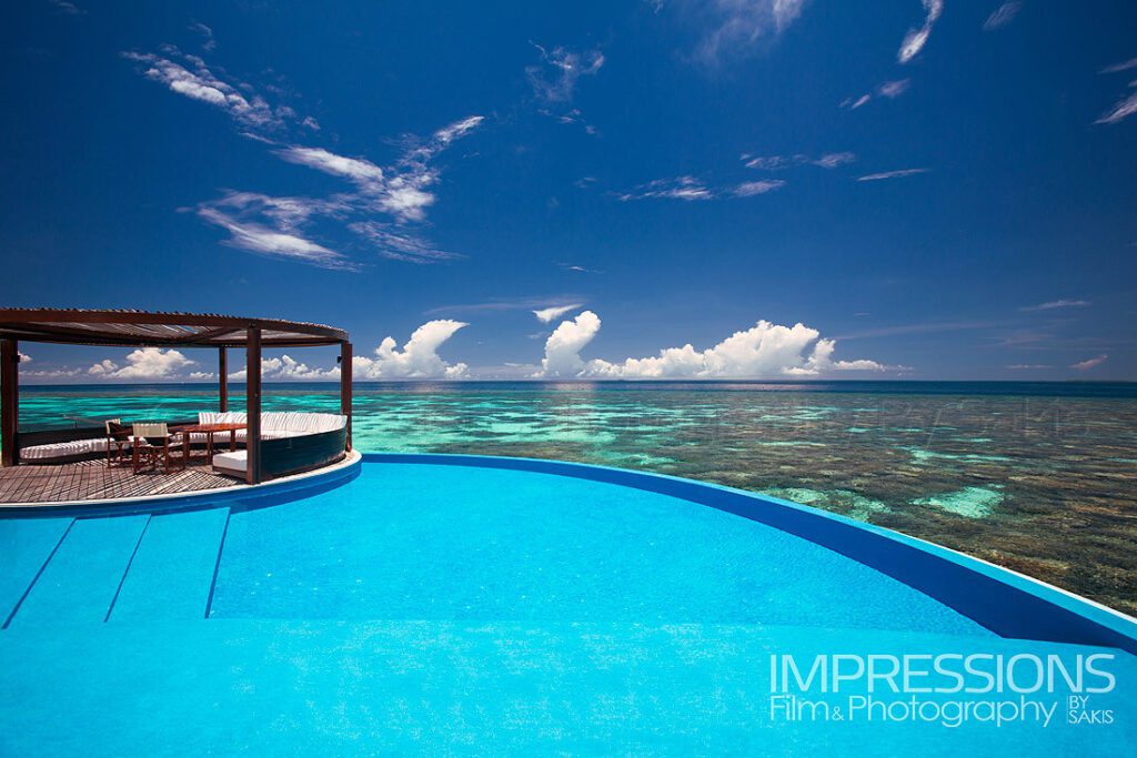 w maldives resort hero shot overwater villas lagoon view