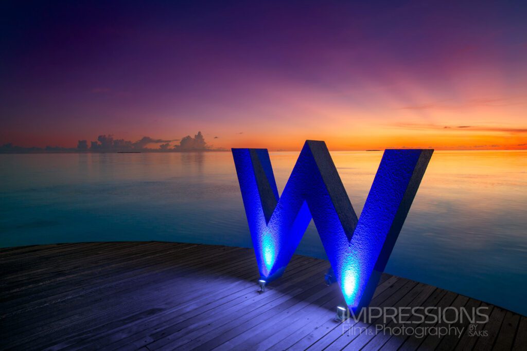w maldives resort hero shot w logo branding sunset
